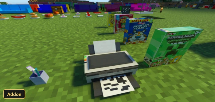 printer, small plant, and cereal boxes on grass