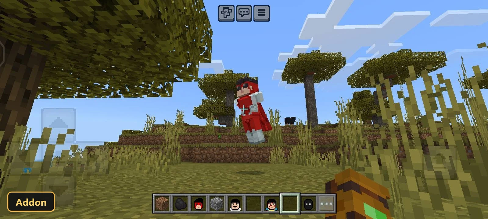 red-caped character skin floating above a grassy plains biome