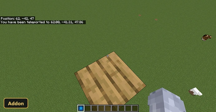 single wooden block on grass, looking down from above