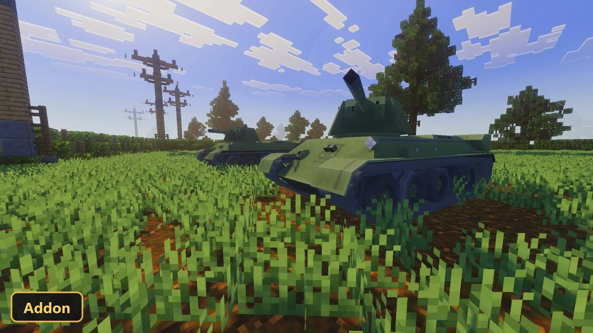 two green tanks in a field of green grass with utility poles
