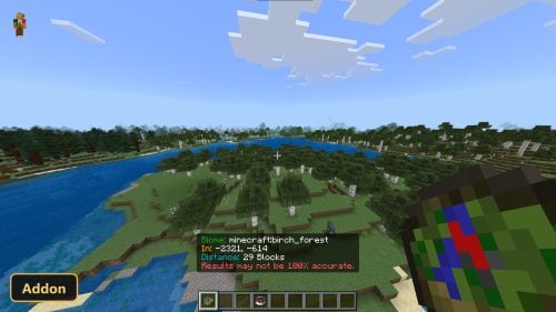 player holding a compass, showing biome location data on screen