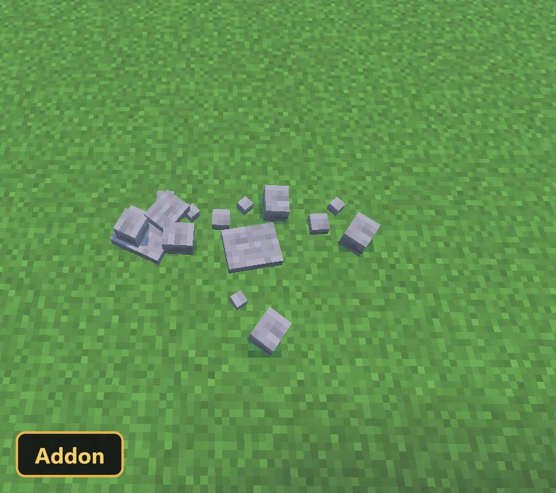 scattered stone pieces on a grassy field