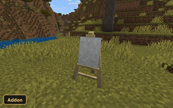 a blank easel in a grassy field