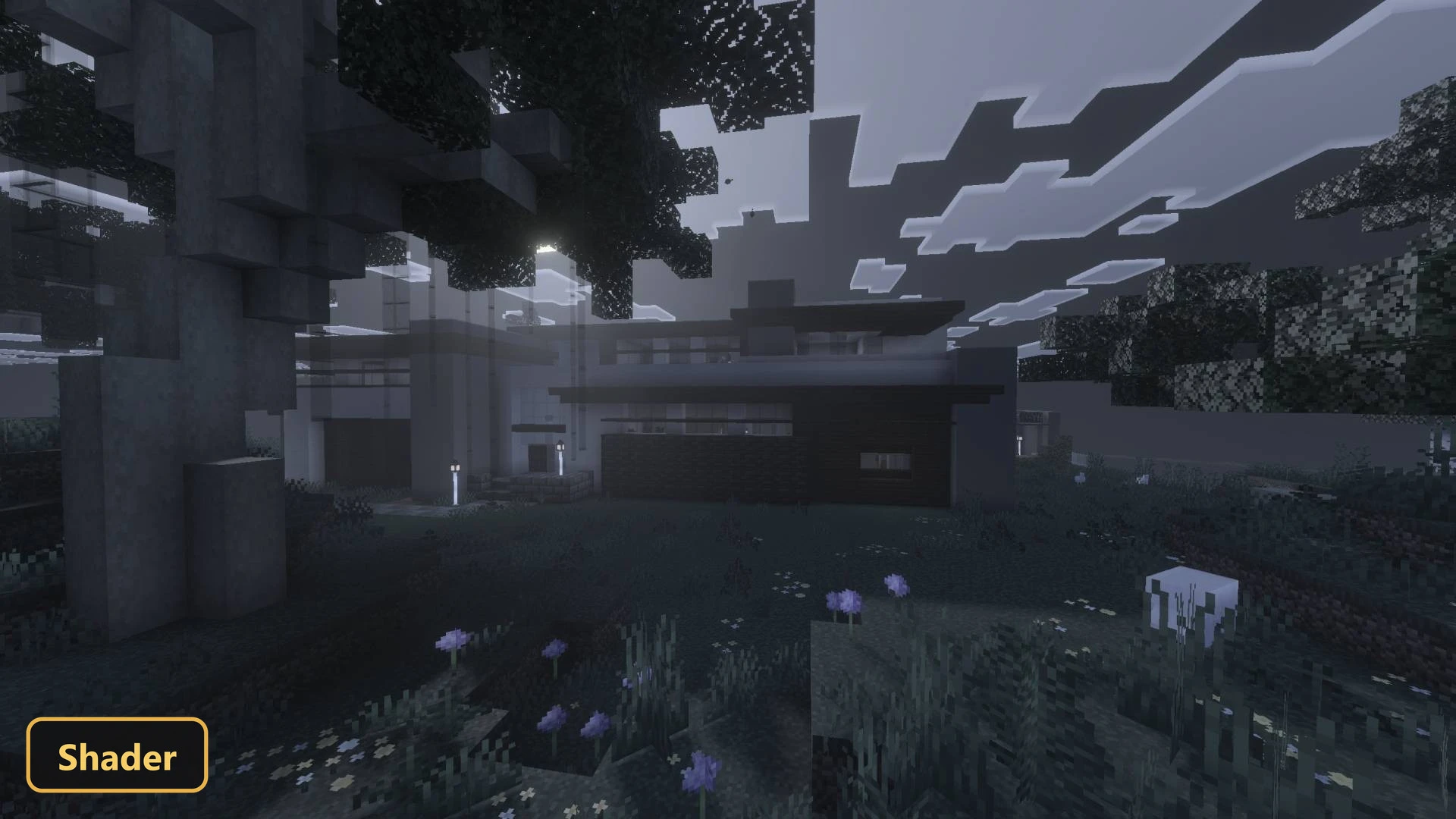 modern house in a dark, foggy field with trees and flowers